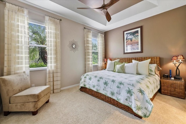 13180 SW Pembroke Cir N, Lake Suzy, FL 34269 - bedroom featuring carpet, baseboards, ceiling fan, and a raised ceiling