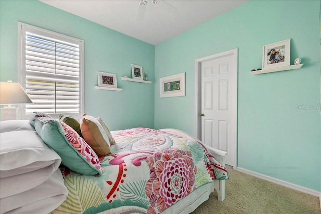 13180 SW Pembroke Cir N, Lake Suzy, FL 34269 - carpeted bedroom with a ceiling fan and baseboards