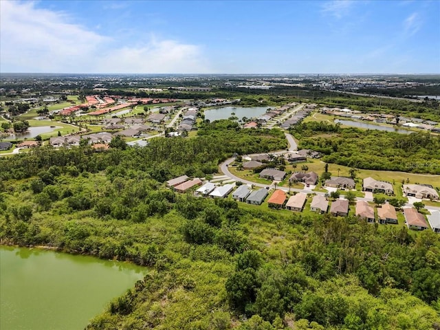 13180 SW Pembroke Cir N, Lake Suzy, FL 34269 - aerial perspective of suburban area with a nearby body of water