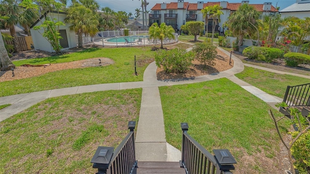 view of property's community featuring a pool and a residential view