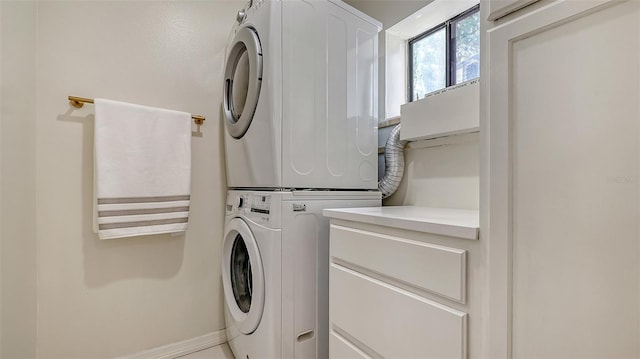 laundry room with estacked washer and dryer