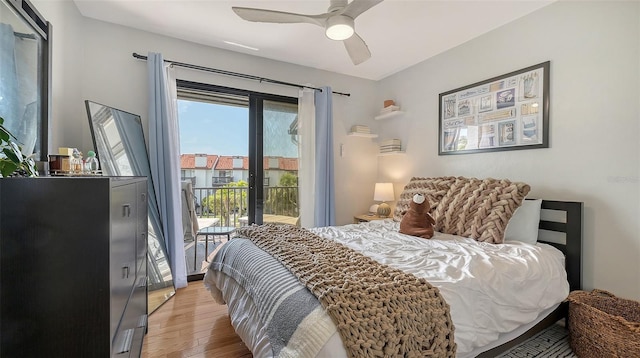 bedroom featuring access to exterior, light wood-style floors, and a ceiling fan