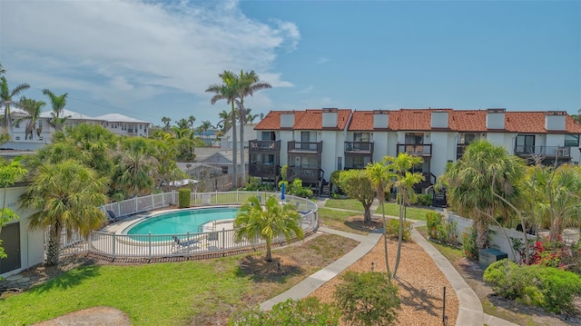 community pool with a residential view