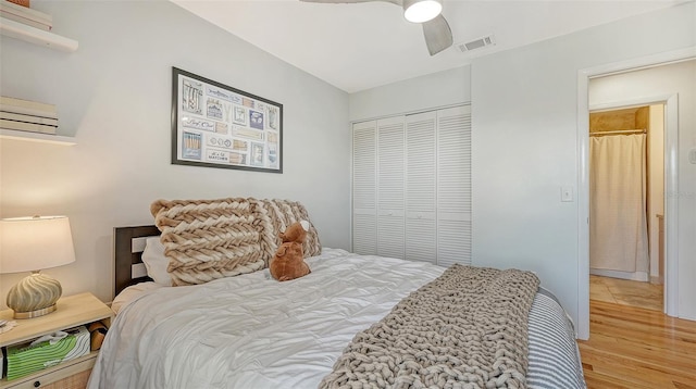 bedroom featuring wood finished floors, a closet, and a ceiling fan
