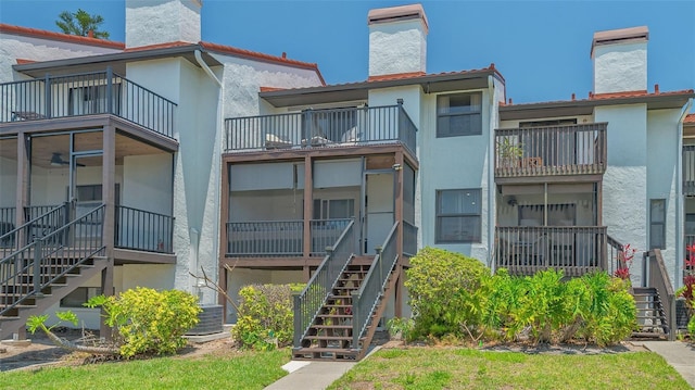 view of property featuring stairway