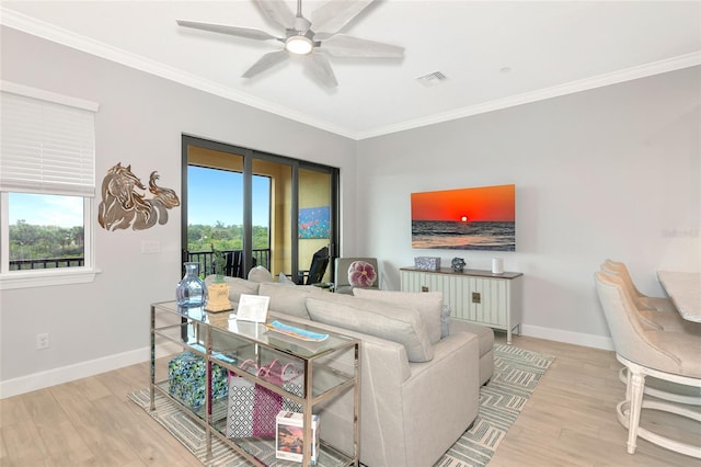 5561 Cannes Cir Unit 5101, Sarasota, FL 34231 - living room featuring wood finished floors, healthy amount of natural light, baseboards, and crown molding