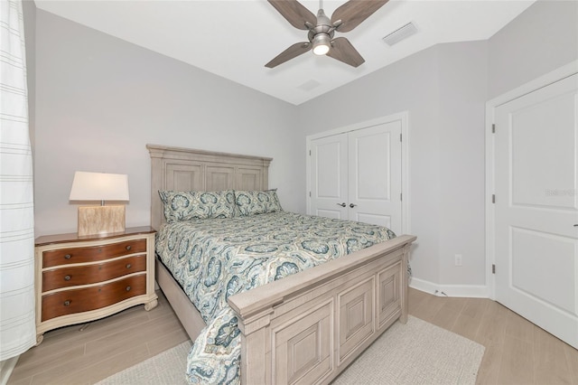 5561 Cannes Cir Unit 5101, Sarasota, FL 34231 - bedroom with light wood-style floors, a closet, a ceiling fan, and baseboards