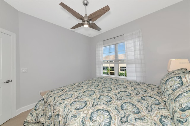 5561 Cannes Cir Unit 5101, Sarasota, FL 34231 - bedroom featuring a ceiling fan and wood finished floors