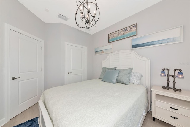 5561 Cannes Cir Unit 5101, Sarasota, FL 34231 - bedroom with wood finished floors and a chandelier