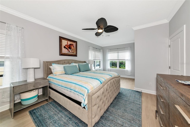 5561 Cannes Cir Unit 5101, Sarasota, FL 34231 - bedroom featuring baseboards, light wood-style floors, ornamental molding, and ceiling fan