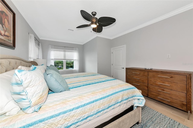 5561 Cannes Cir Unit 5101, Sarasota, FL 34231 - bedroom with crown molding, a ceiling fan, and wood finished floors