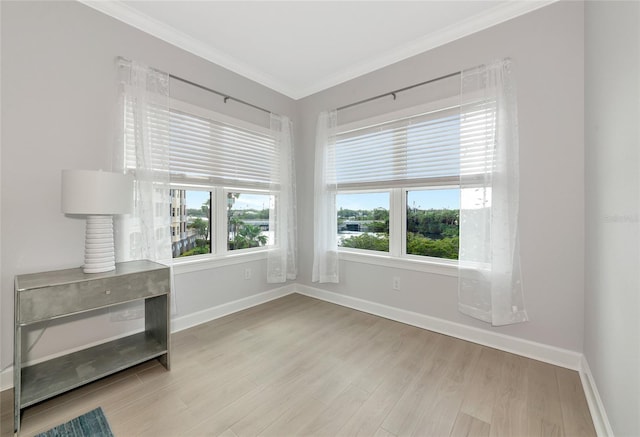 5561 Cannes Cir Unit 5101, Sarasota, FL 34231 - spare room featuring wood finished floors, ornamental molding, and baseboards