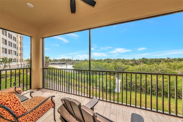 5561 Cannes Cir Unit 5101, Sarasota, FL 34231 - sunroom featuring a water view