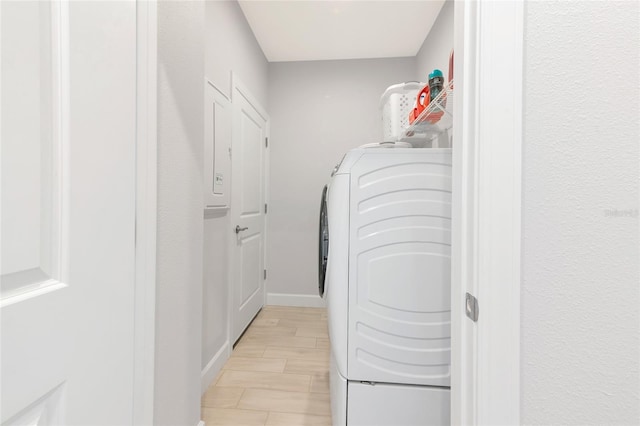 5561 Cannes Cir Unit 5101, Sarasota, FL 34231 - laundry area featuring separate washer and dryer and baseboards