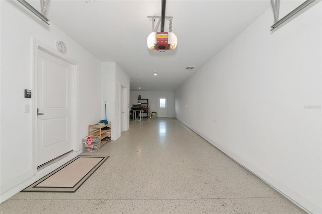 5561 Cannes Cir Unit 5101, Sarasota, FL 34231 - garage featuring a garage door opener