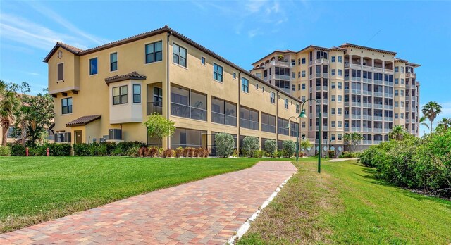 5561 Cannes Cir Unit 5101, Sarasota, FL 34231 - view of apartment building / complex featuring central AC