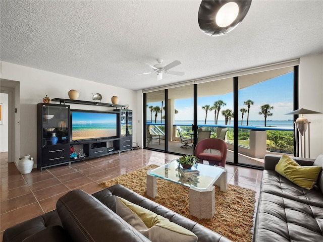 2120 Harbourside Dr Unit 617, Longboat Key, FL 34228 - tiled living area with a wall of windows, plenty of natural light, ceiling fan, and a textured ceiling