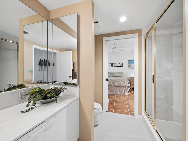 2120 Harbourside Dr Unit 617, Longboat Key, FL 34228 - full bathroom with a stall shower, toilet, ensuite bath, a ceiling fan, and tile patterned flooring