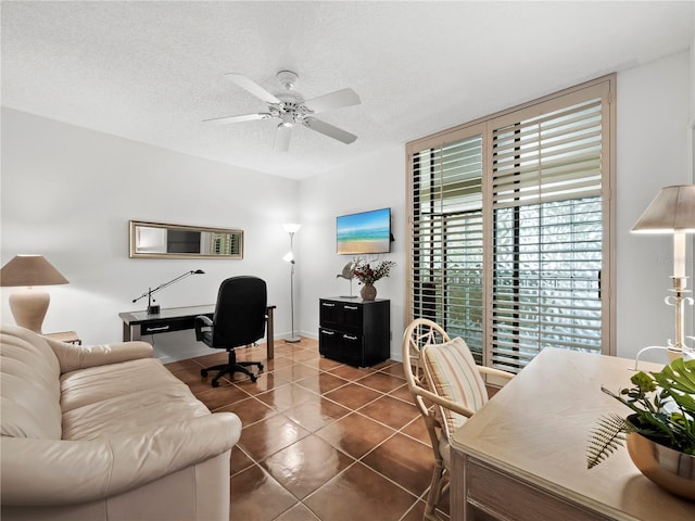 2120 Harbourside Dr Unit 617, Longboat Key, FL 34228 - home office featuring ceiling fan, dark tile patterned flooring, a textured ceiling, and baseboards