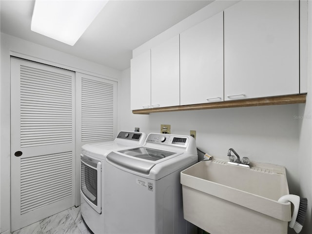 2120 Harbourside Dr Unit 617, Longboat Key, FL 34228 - laundry room with independent washer and dryer, cabinet space, and light marble finish floors