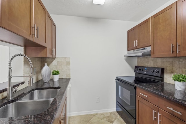 kitchen with black range with electric cooktop, under cabinet range hood, a sink, tasteful backsplash, and dark stone counters