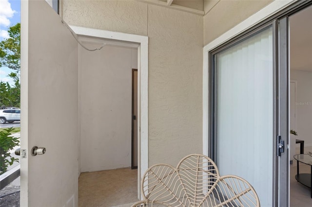 doorway to property with stucco siding