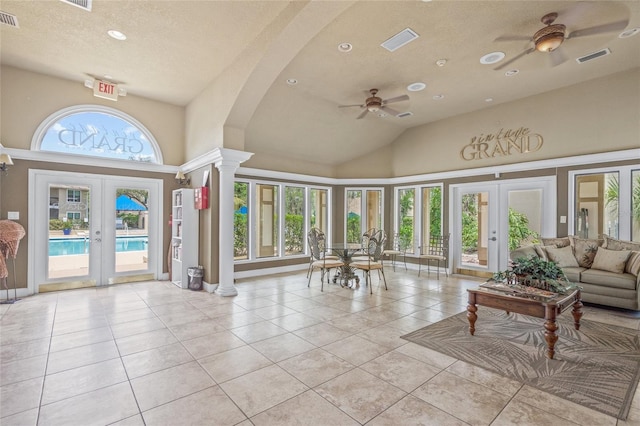 common area featuring vaulted ceiling, a textured ceiling, and recessed lighting