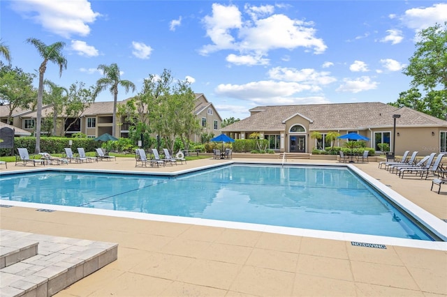 community pool with a patio