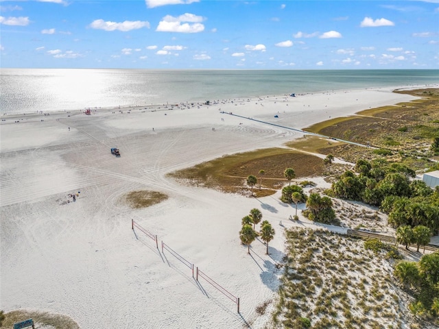 drone / aerial view of waterfront with a beach