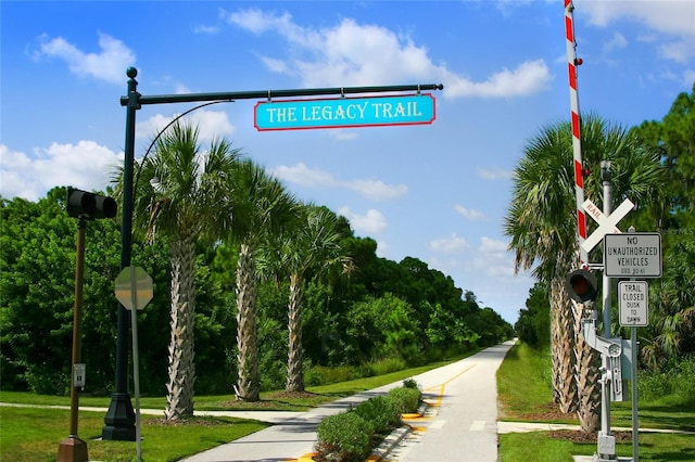 view of property's community with a yard