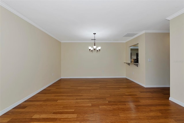 4471 Atwood Cay Cir Unit 13, Sarasota, FL 34233 - unfurnished dining area featuring a chandelier, baseboards, wood finished floors, and crown molding