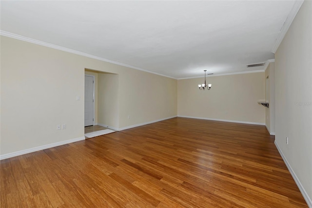 4471 Atwood Cay Cir Unit 13, Sarasota, FL 34233 - unfurnished room with a chandelier, light wood-style flooring, ornamental molding, and baseboards