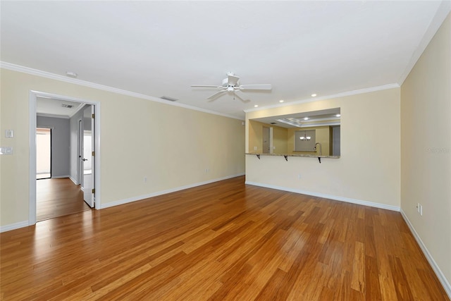 4471 Atwood Cay Cir Unit 13, Sarasota, FL 34233 - unfurnished living room featuring ceiling fan, light wood-style floors, baseboards, crown molding, and a sink