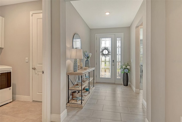 entrance foyer with baseboards, light tile patterned floors, and recessed lighting