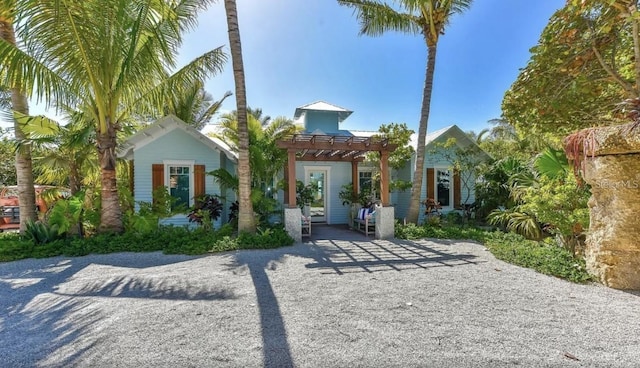 102 48th St, Holmes Beach, FL 34217 - view of front facade featuring a pergola
