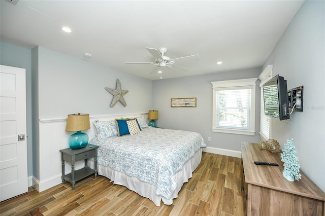 102 48th St, Holmes Beach, FL 34217 - bedroom with wood finished floors, baseboards, recessed lighting, and a ceiling fan