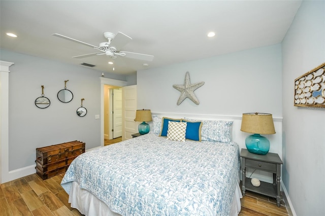102 48th St, Holmes Beach, FL 34217 - bedroom featuring wood finished floors, baseboards, recessed lighting, and a ceiling fan