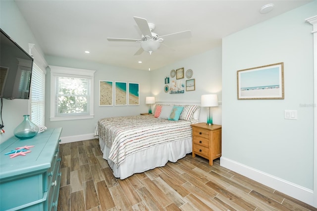 102 48th St, Holmes Beach, FL 34217 - bedroom featuring baseboards, wood finished floors, ceiling fan, and recessed lighting