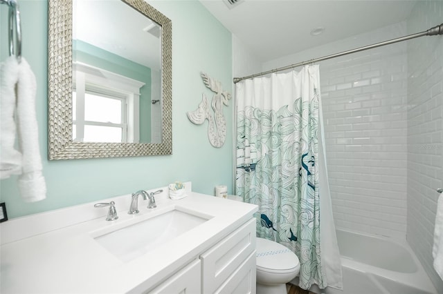 102 48th St, Holmes Beach, FL 34217 - bathroom featuring toilet, shower / tub combo with curtain, and vanity