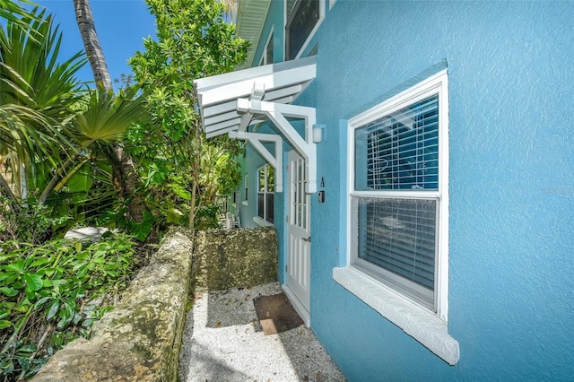 102 48th St, Holmes Beach, FL 34217 - view of property exterior with stucco siding
