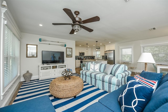 102 48th St, Holmes Beach, FL 34217 - living room featuring recessed lighting, baseboards, and ceiling fan