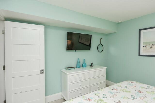 102 48th St, Holmes Beach, FL 34217 - bedroom featuring baseboards