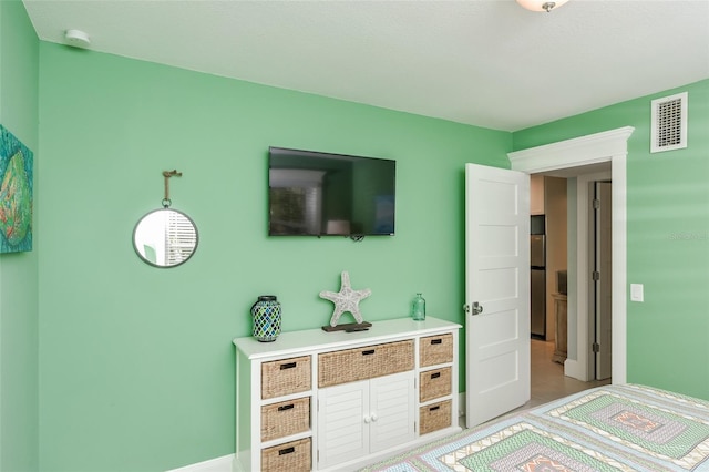 102 48th St, Holmes Beach, FL 34217 - bedroom with freestanding refrigerator
