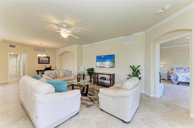 6907 Grand Estuary Trl Unit 104, Bradenton, FL 34212 - living area featuring a chandelier, ornamental molding, ceiling fan, light tile patterned floors, and arched walkways