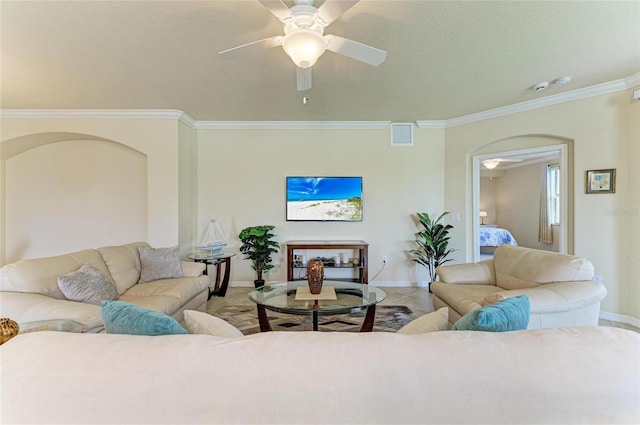6907 Grand Estuary Trl Unit 104, Bradenton, FL 34212 - living room featuring ceiling fan, baseboards, crown molding, arched walkways, and a textured ceiling