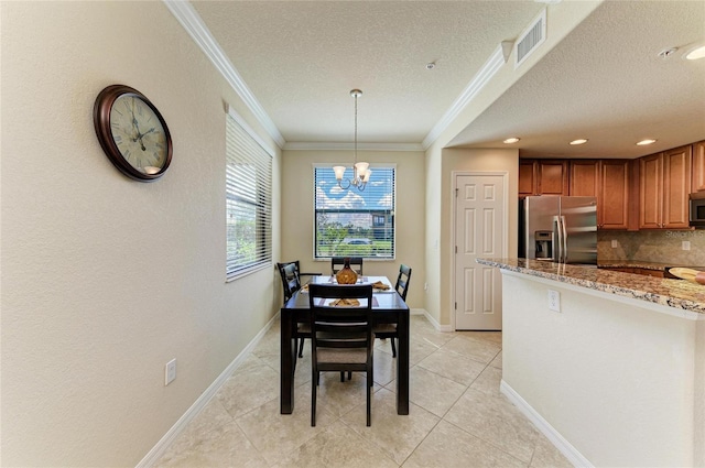 6907 Grand Estuary Trl Unit 104, Bradenton, FL 34212 - dining room with crown molding, a textured ceiling, a chandelier, baseboards, and light tile patterned flooring