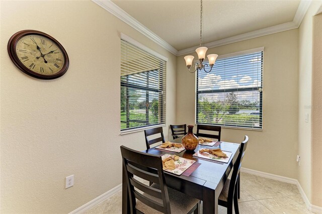 6907 Grand Estuary Trl Unit 104, Bradenton, FL 34212 - dining space with a chandelier, ornamental molding, light tile patterned flooring, and baseboards