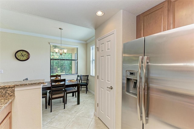 6907 Grand Estuary Trl Unit 104, Bradenton, FL 34212 - kitchen with stainless steel refrigerator with ice dispenser, a chandelier, light tile patterned flooring, ornamental molding, and light stone counters
