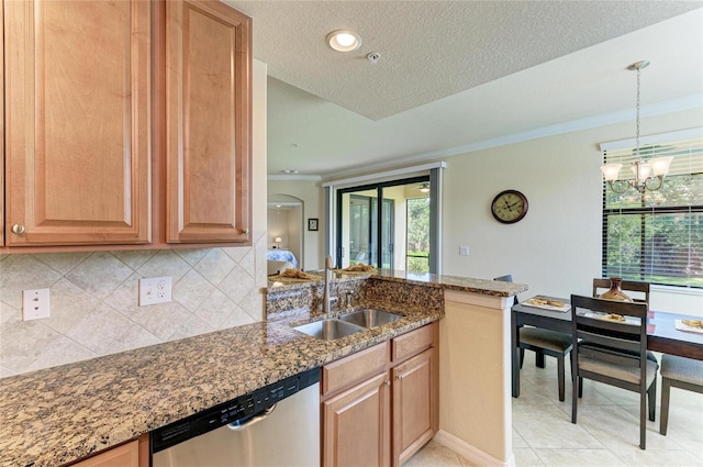 6907 Grand Estuary Trl Unit 104, Bradenton, FL 34212 - kitchen with dishwasher, a sink, crown molding, dark stone counters, and a chandelier