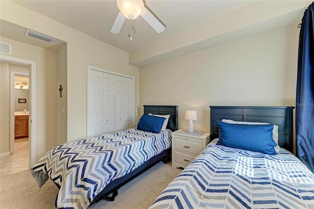 6907 Grand Estuary Trl Unit 104, Bradenton, FL 34212 - bedroom with light carpet, a closet, and ceiling fan